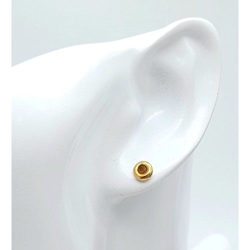 631 - A pair of 9K yellow gold stone set stud earrings. Total weight 0.8G.