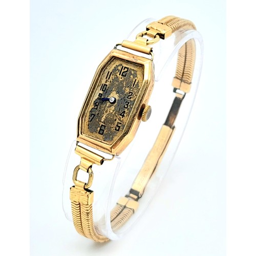 919 - A 9K Gold Cased Vintage Watch. In need of repair so a/f. Bracelet is rolled gold.