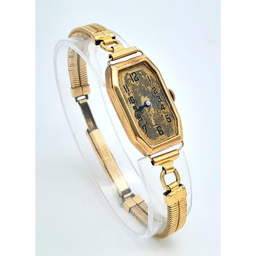 919 - A 9K Gold Cased Vintage Watch. In need of repair so a/f. Bracelet is rolled gold.