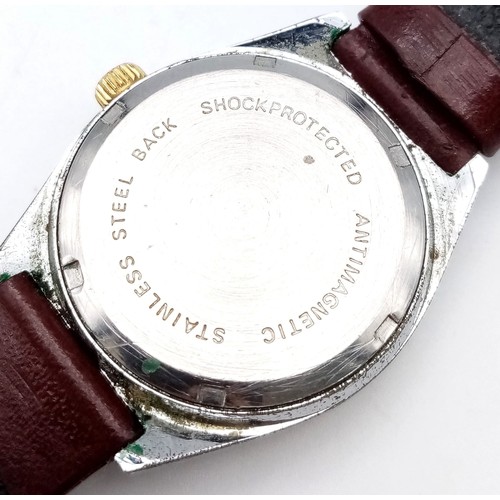 638 - A Vintage Remex De Luxe Automatic Gents Watch. Burgundy leather strap. Stainless steel case - 33mm. ... 