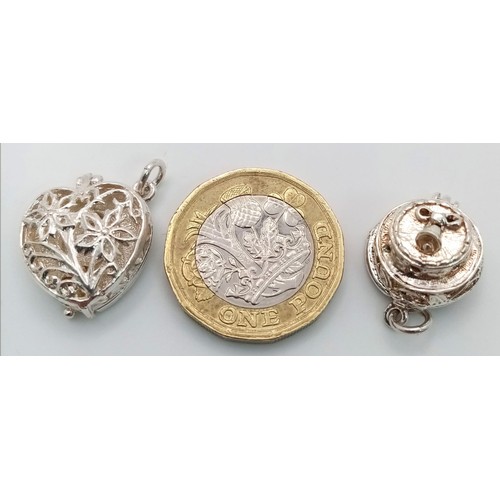 1006 - 2 X STERLING SILVER CHARMS WEDDING CAKE WHICH OPENS TO REVEAL A BRIDE AND GROOM AND A HEART WHICH OP... 