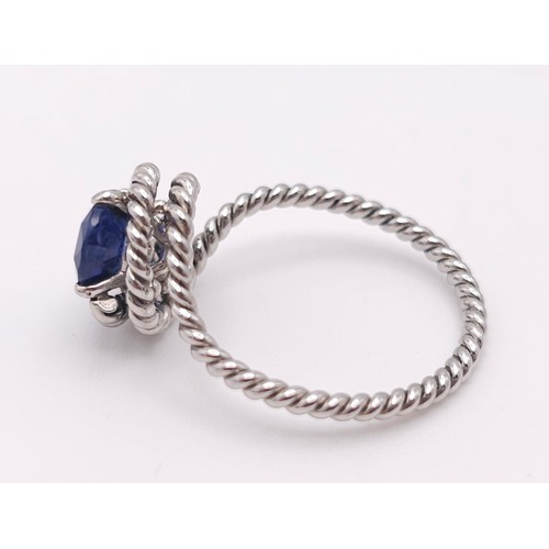 967 - A Twisted Platinum and 2ct Sapphire Ring. Size M. 4g total weight.