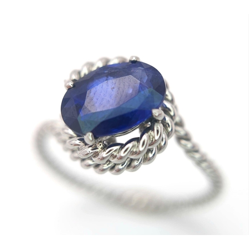 967 - A Twisted Platinum and 2ct Sapphire Ring. Size M. 4g total weight.