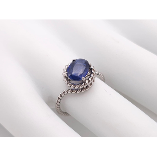 967 - A Twisted Platinum and 2ct Sapphire Ring. Size M. 4g total weight.