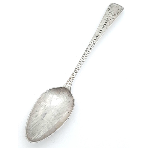 1132 - An antique Georgian sterling silver teaspoon with fabulous patterns engraved on handle. Total weight... 