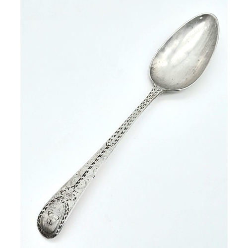 1132 - An antique Georgian sterling silver teaspoon with fabulous patterns engraved on handle. Total weight... 