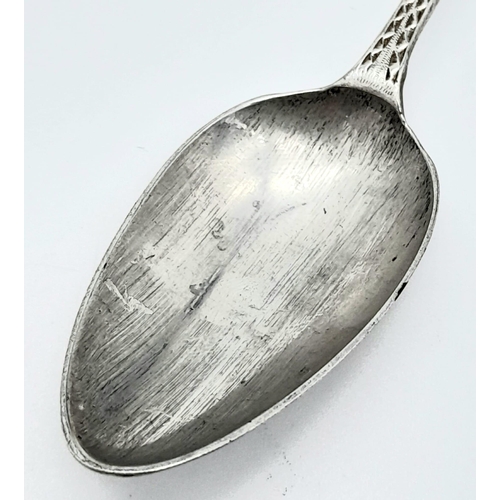 1132 - An antique Georgian sterling silver teaspoon with fabulous patterns engraved on handle. Total weight... 