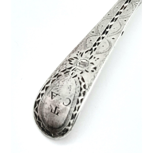 1132 - An antique Georgian sterling silver teaspoon with fabulous patterns engraved on handle. Total weight... 