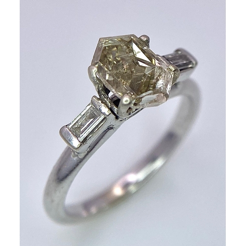 1251 - A LARGE 1ct TRAPEZE CUT CHAMPAGNE DIAMOND FLANKED BY BAGUETTE DIAMOND SHOULDERS SET IN 18K GOLD .2.6... 