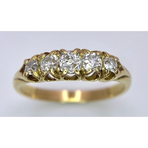 1258 - AN ANTIQUE 5 STONE OLD CUT DIAMOND RING SET IN 18K GOLD .3.0gms   size N