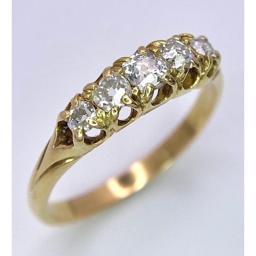 1258 - AN ANTIQUE 5 STONE OLD CUT DIAMOND RING SET IN 18K GOLD .3.0gms   size N