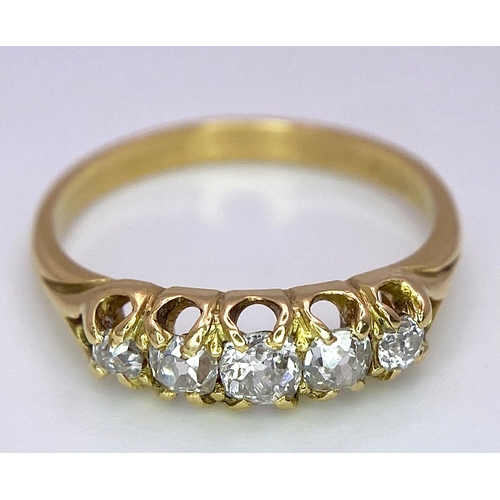 1258 - AN ANTIQUE 5 STONE OLD CUT DIAMOND RING SET IN 18K GOLD .3.0gms   size N