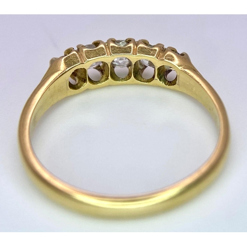 1258 - AN ANTIQUE 5 STONE OLD CUT DIAMOND RING SET IN 18K GOLD .3.0gms   size N