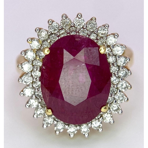 909 - An 18K Ruby and Diamond Ring. Central oval cut 7.75ct ruby with a diamond surround. Comes with a IGI... 