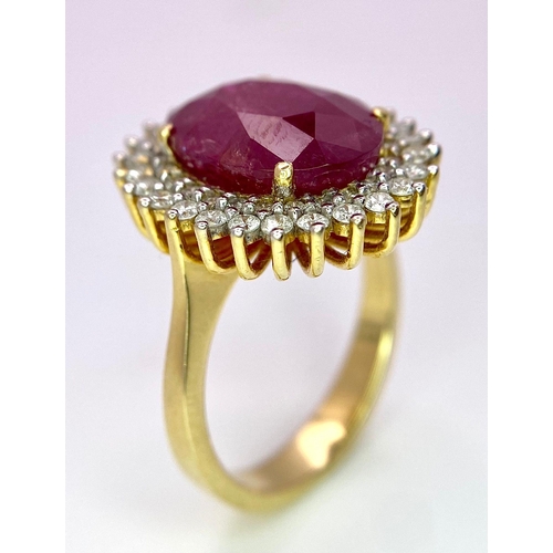 909 - An 18K Ruby and Diamond Ring. Central oval cut 7.75ct ruby with a diamond surround. Comes with a IGI... 