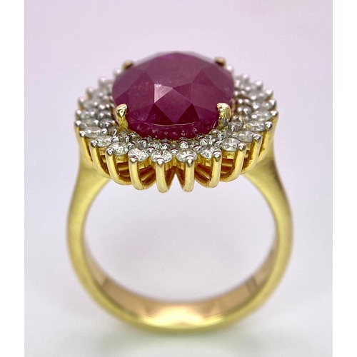 909 - An 18K Ruby and Diamond Ring. Central oval cut 7.75ct ruby with a diamond surround. Comes with a IGI... 