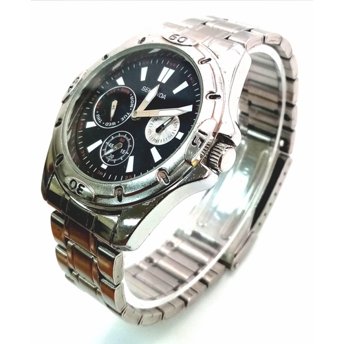 1178 - A Sekonda Quartz Gents Watch. Stainless steel bracelet and case - 40mm. Black dial with three sub di... 