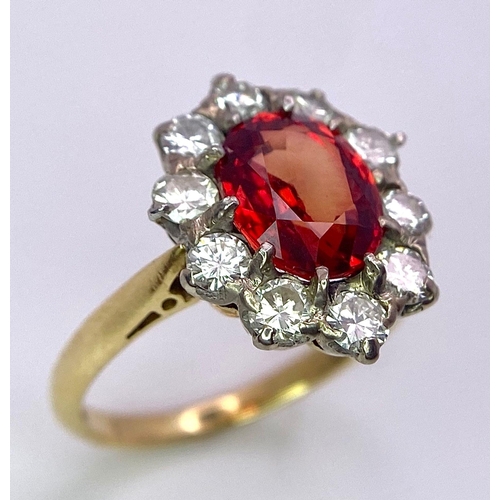 1230 - A TOP QUALITY 2.7ct NATURAL RUBY SURROUNDED BY A CLUSTER OF DIAMONDS AND SET IN 18K GOLD .   3.6gms ... 