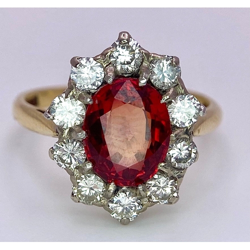 1230 - A TOP QUALITY 2.7ct NATURAL RUBY SURROUNDED BY A CLUSTER OF DIAMONDS AND SET IN 18K GOLD .   3.6gms ... 