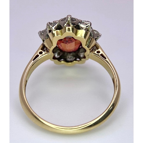 1230 - A TOP QUALITY 2.7ct NATURAL RUBY SURROUNDED BY A CLUSTER OF DIAMONDS AND SET IN 18K GOLD .   3.6gms ... 