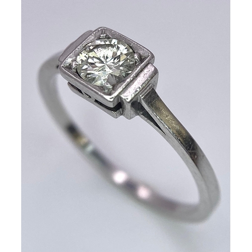 1244 - AN ANTIQUE ART DECO PLATINUM SOLITAIRE RING WITH JUST UNDER HALF A CARAT OF FINE CLEAN DIAMOND . 3.1... 