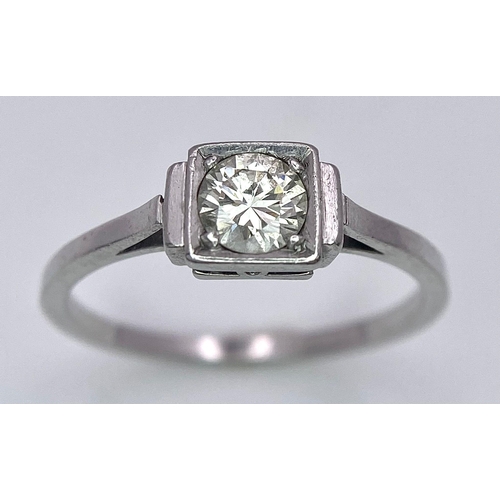 1244 - AN ANTIQUE ART DECO PLATINUM SOLITAIRE RING WITH JUST UNDER HALF A CARAT OF FINE CLEAN DIAMOND . 3.1... 