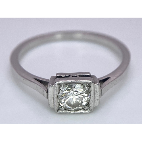 1244 - AN ANTIQUE ART DECO PLATINUM SOLITAIRE RING WITH JUST UNDER HALF A CARAT OF FINE CLEAN DIAMOND . 3.1... 