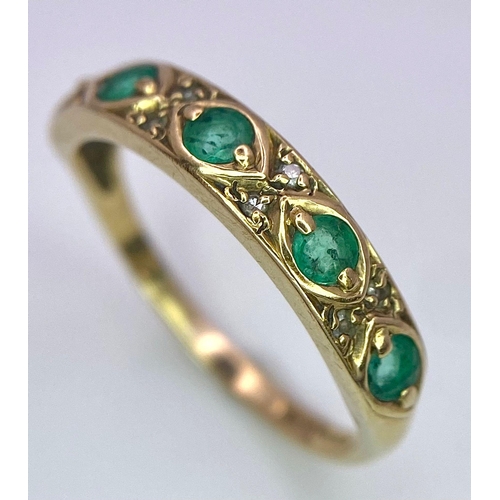 1264 - A 9K GOLD RING WITH EMERALD AND DIAMONDS .  1.6gms   size M