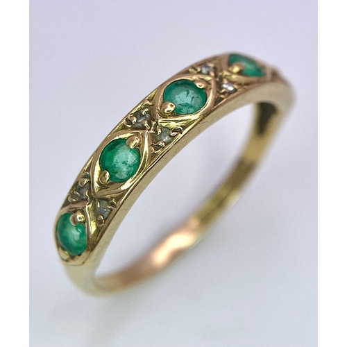 1264 - A 9K GOLD RING WITH EMERALD AND DIAMONDS .  1.6gms   size M