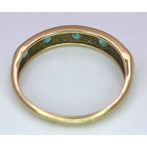 1264 - A 9K GOLD RING WITH EMERALD AND DIAMONDS .  1.6gms   size M