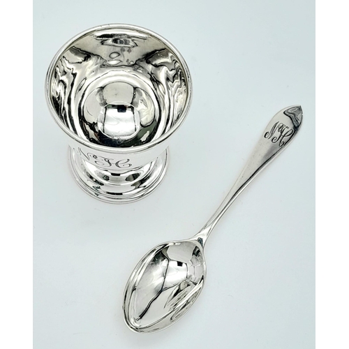 1299 - A Vintage Sterling Silver Egg Cup and Spoon. Birmingham hallmarks. 46g total weight.