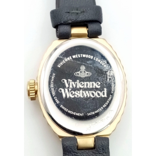 1309 - A Vivienne Westwood Oval Shell Watch. Grey leather strap. Gilded ceramic case - 21mm. Pink dial. Qua... 