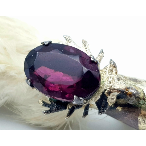 1359 - A Vintage Scottish Grouse Foot Brooch. Purple gemstone decoration. 8cm.