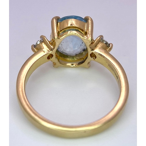 1391 - A STUNNING OVAL FACETED AQUAMARINE AND DIAMOND RING SET IN 18K GOLD .    5.1gms   size M