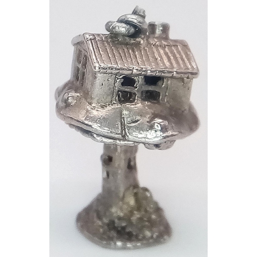 1127 - A VINTAGE STERLING SILVER TREE HOUSE CHARM, WHICH OPENS TO REVEAL A WIZARD INSIDE, WEIGHT 4G