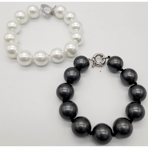 1167 - Two Stylish South Sea Pearl Shell Bracelets. Dark grey and white. Both 14mm beads. 17 and 18cm lengt... 