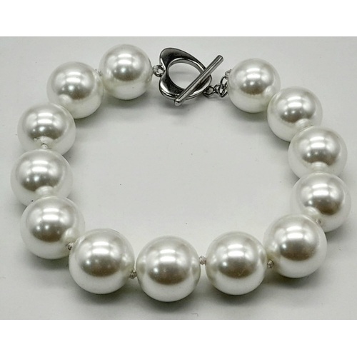 1167 - Two Stylish South Sea Pearl Shell Bracelets. Dark grey and white. Both 14mm beads. 17 and 18cm lengt... 