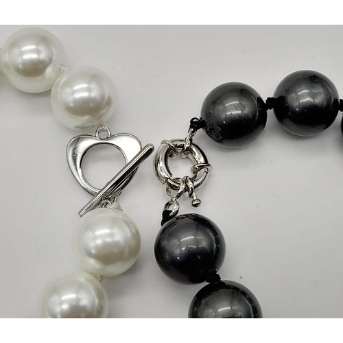 1167 - Two Stylish South Sea Pearl Shell Bracelets. Dark grey and white. Both 14mm beads. 17 and 18cm lengt... 