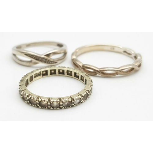 1278 - A collection of 2 stylist twisted rings with size L/M and V & a stone set ring with size N/O. Total ... 