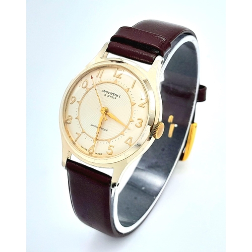 1358 - A Vintage Ingersoll Mechanical Gents Watch. Burgundy leather strap. Gilded case - 32mm. Cream dial. ... 