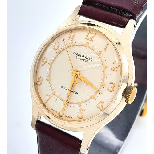 1358 - A Vintage Ingersoll Mechanical Gents Watch. Burgundy leather strap. Gilded case - 32mm. Cream dial. ... 