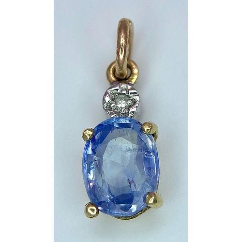 1360 - A NATURAL UNTREATED SAPPHIRE AND DIAMOND PENDANT .    1.0gms