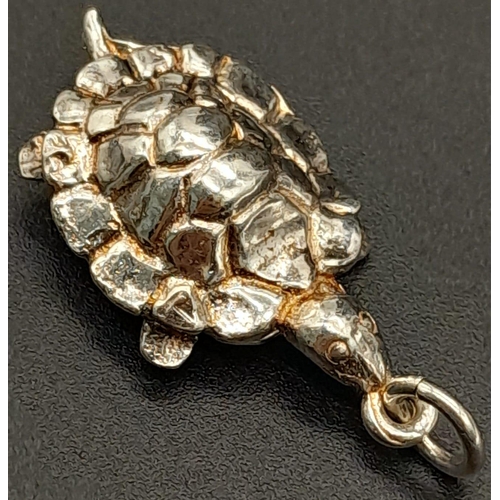 1120 - STERLING SILVER TORTOISE CHARM, WHICH OPENS TO REVEAL A HARE DEPICTING THE FAMOUS TORTOISE AND THE H... 