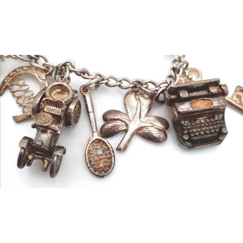 1155 - A 925 silver multiple charms bracelet include Royal crown, racket, etc. Total weight 52.6G. Please s... 