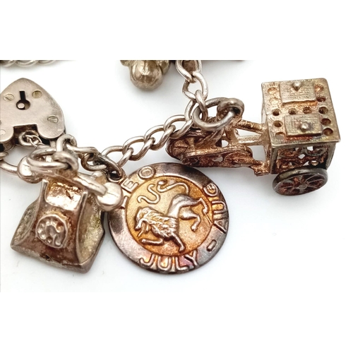 1155 - A 925 silver multiple charms bracelet include Royal crown, racket, etc. Total weight 52.6G. Please s... 