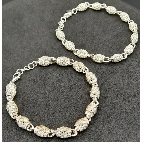 1233 - 2X fancy  925 silver hollow link bracelets  . Total weight 28.28G. Total length 21cm.