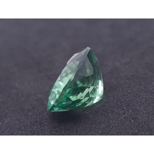 1303 - A Mesmerising 26ct Green Hiddenite Gemstone. Oval cut and well faceted. No visible marks of inclusio... 