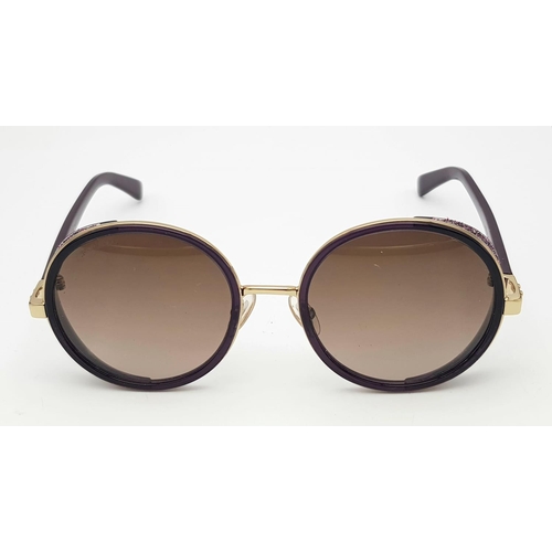 1383 - A Jimmy Choo ladies sunglasses in original snake skin case.