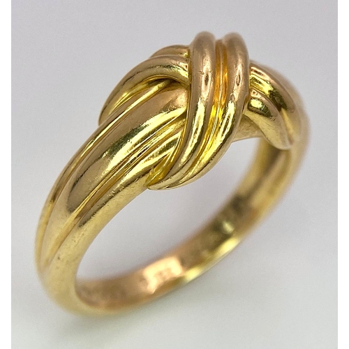 16 - A Beautiful Tiffany and Co. 18K Gold Love Ring. Tiffany and co. markings. Size N. 7.2g weight.