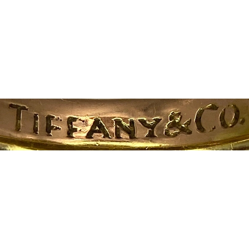 16 - A Beautiful Tiffany and Co. 18K Gold Love Ring. Tiffany and co. markings. Size N. 7.2g weight.